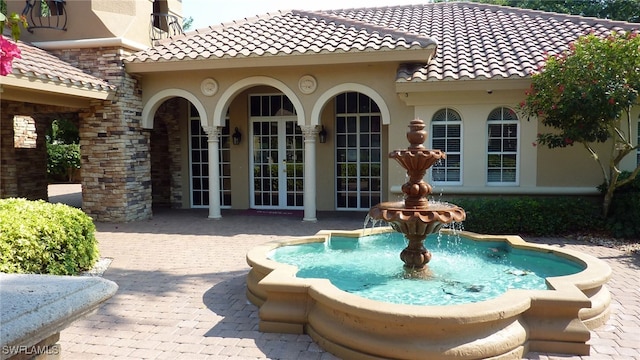 view of swimming pool featuring pool water feature