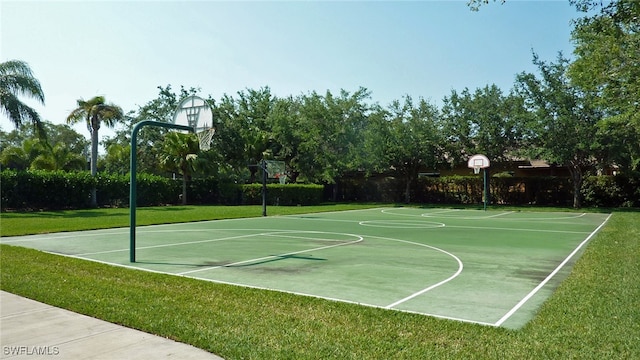 view of basketball court featuring a lawn