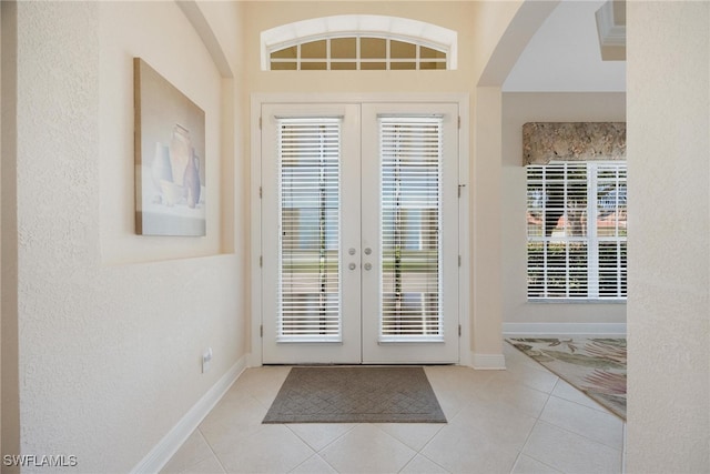 doorway to outside featuring french doors and light tile patterned floors