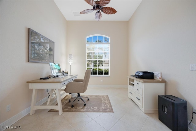 tiled home office featuring ceiling fan