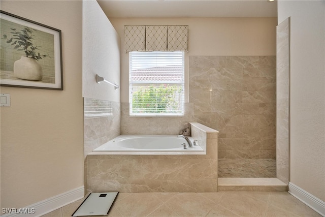 bathroom with tile patterned flooring and independent shower and bath