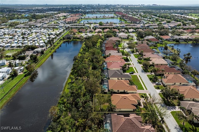 bird's eye view with a water view