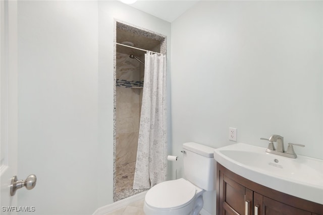 bathroom with vanity, a shower with curtain, toilet, and tile patterned flooring