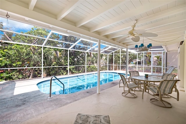 view of swimming pool featuring a patio area, a lanai, and ceiling fan