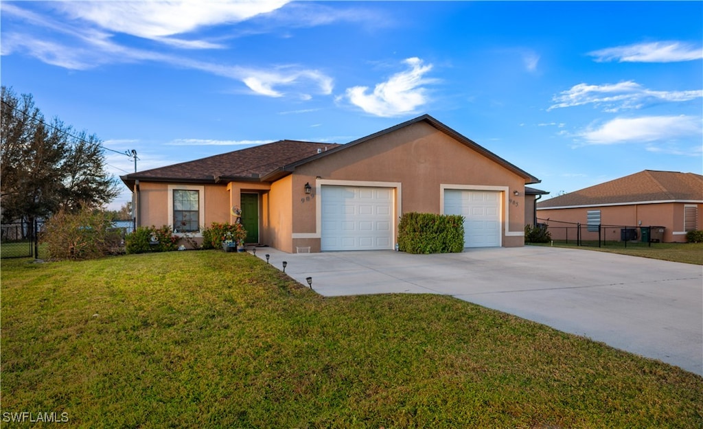 905/909 Mohawk Pkwy, Cape Coral, FL 33914 - ranch-style house with a front yard and a garage