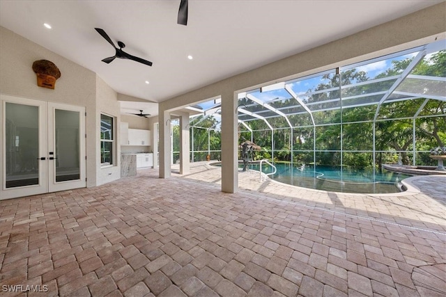 view of pool featuring ceiling fan, a patio, and a lanai