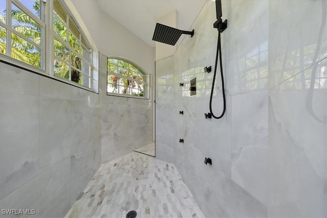 bathroom with tiled shower