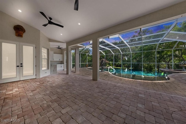 12800 Treeline Ct, North Fort Myers, FL 33903 - view of patio / terrace featuring a ceiling fan, exterior kitchen, a lanai, and french doors