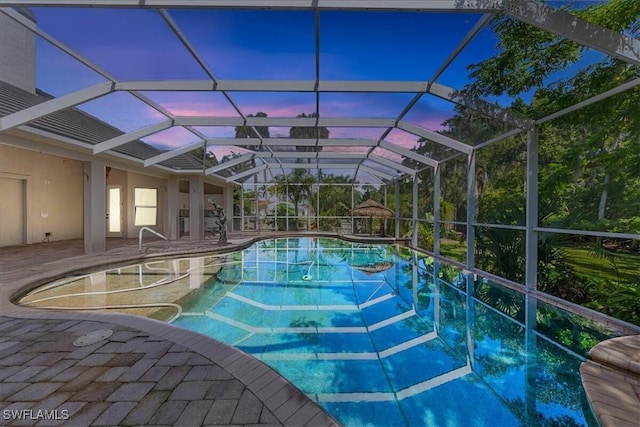 12800 Treeline Ct, North Fort Myers, FL 33903 - swimming pool featuring a patio and glass enclosure