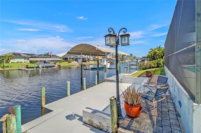 view of dock with a water view and a lanai