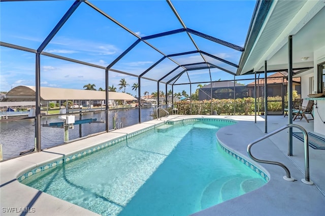 view of swimming pool featuring a patio, a lanai, a boat dock, and a water view