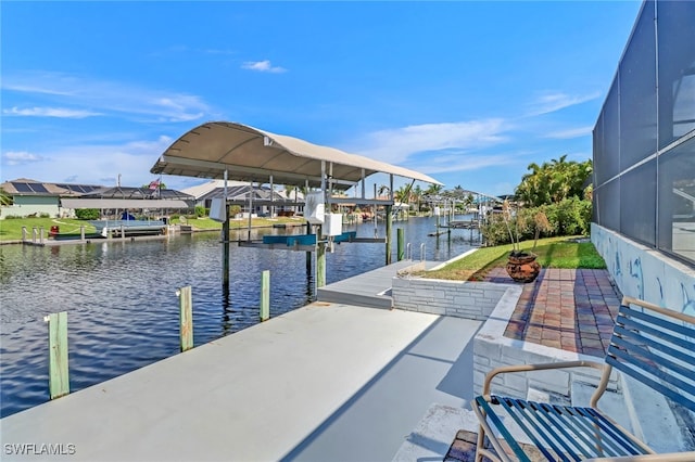 dock area featuring a water view and glass enclosure