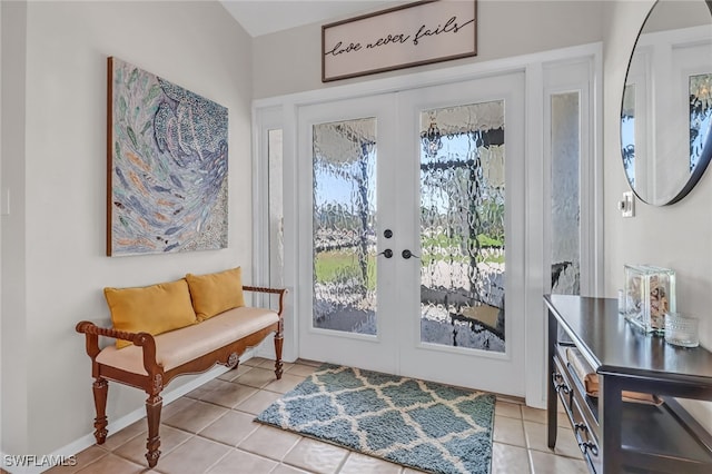 doorway to outside featuring french doors and light tile patterned floors