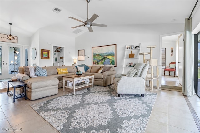 tiled living room with lofted ceiling, french doors, and ceiling fan