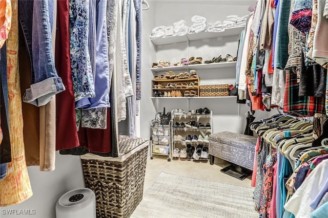 spacious closet with tile patterned flooring