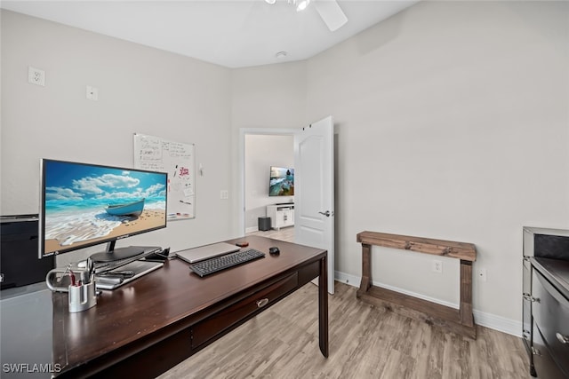 office space with ceiling fan and light hardwood / wood-style flooring