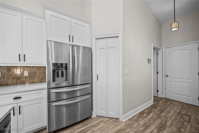 kitchen with white cabinetry, stainless steel fridge with ice dispenser, and hardwood / wood-style flooring