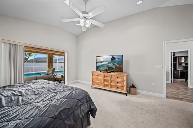 carpeted bedroom featuring ceiling fan and vaulted ceiling