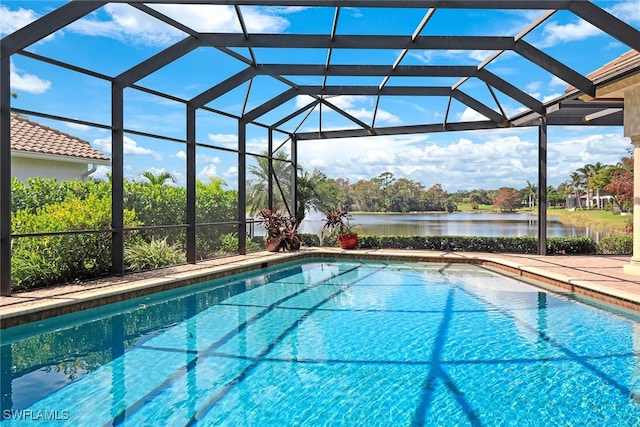 view of pool featuring a lanai and a water view