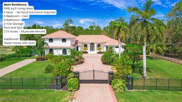 mediterranean / spanish home featuring a front yard