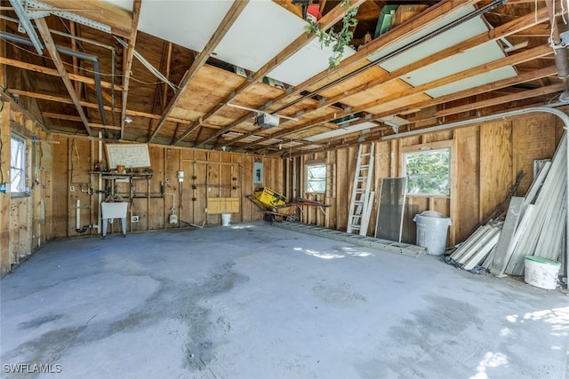 garage with sink and electric panel