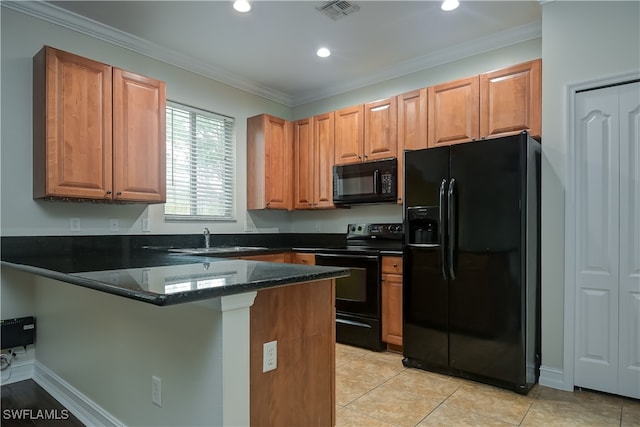 kitchen with kitchen peninsula, dark stone counters, ornamental molding, black appliances, and sink