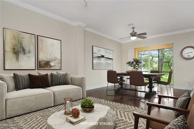 living room with ornamental molding, dark hardwood / wood-style floors, and ceiling fan