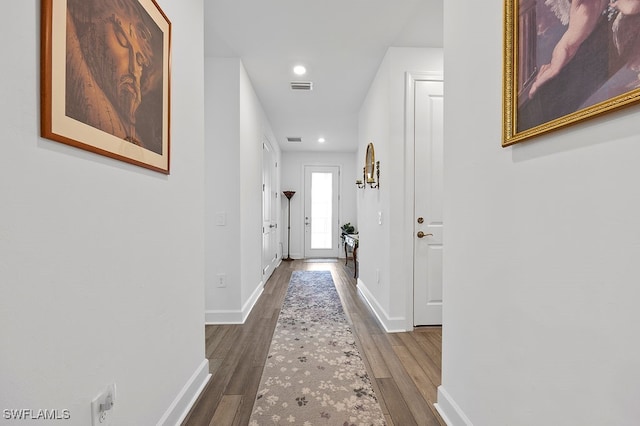 hallway featuring dark wood-type flooring