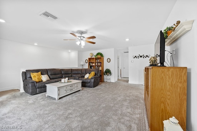 living room with light colored carpet and ceiling fan