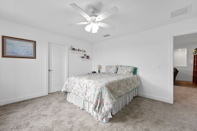 carpeted bedroom with ceiling fan