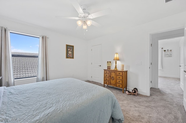 carpeted bedroom featuring ceiling fan