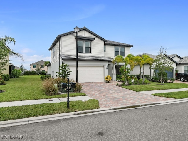 view of front facade featuring a front lawn and a garage