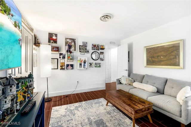 living room featuring dark wood-type flooring