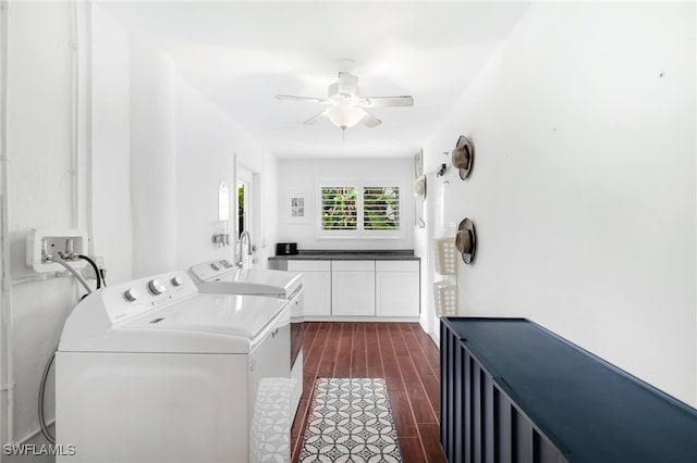 clothes washing area featuring ceiling fan, washer and clothes dryer, and dark hardwood / wood-style floors