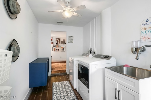 laundry area featuring sink, separate washer and dryer, cabinets, dark hardwood / wood-style flooring, and ceiling fan