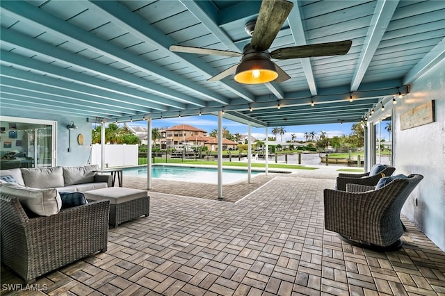 view of patio / terrace with ceiling fan, a fenced in pool, and outdoor lounge area