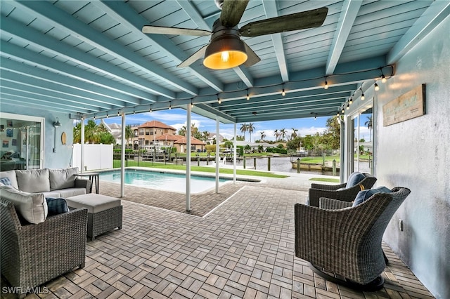 view of pool featuring an outdoor hangout area, a patio, and ceiling fan