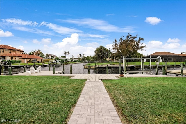 view of dock featuring a yard and a water view