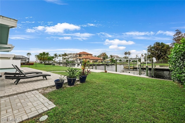 view of yard with a patio area and a water view