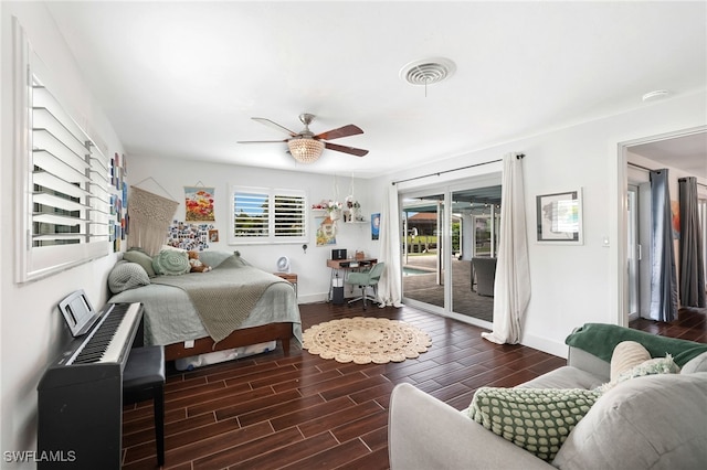 bedroom with multiple windows, access to exterior, dark hardwood / wood-style floors, and ceiling fan