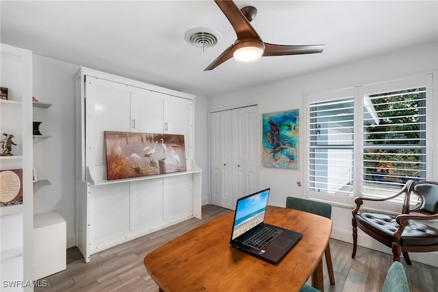 office featuring wood-type flooring and ceiling fan