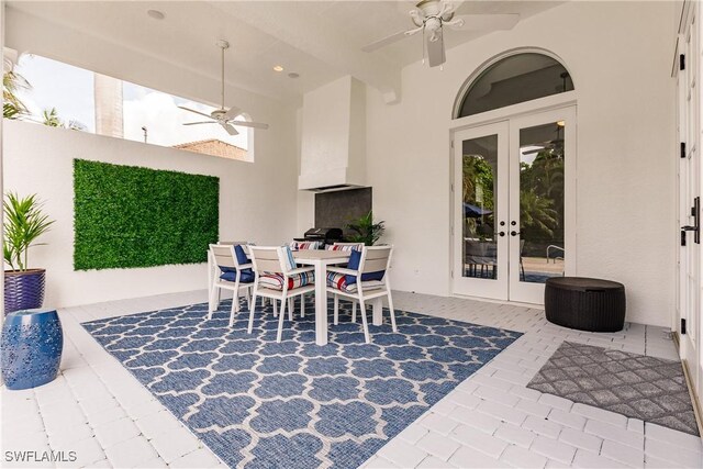 view of patio / terrace featuring ceiling fan and french doors