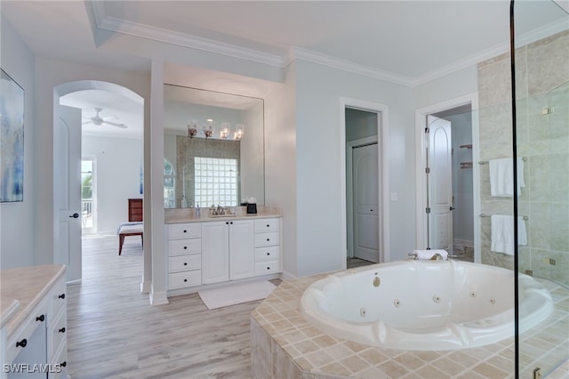 bathroom with ceiling fan, separate shower and tub, crown molding, and vanity