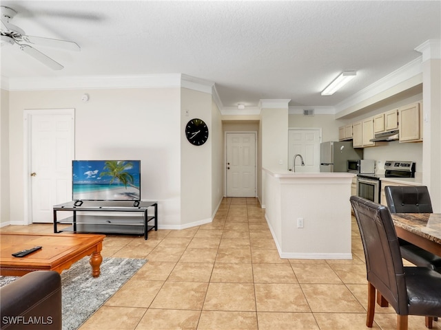 kitchen with appliances with stainless steel finishes, crown molding, a textured ceiling, and ceiling fan