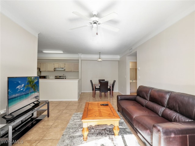 tiled living room featuring ceiling fan and ornamental molding