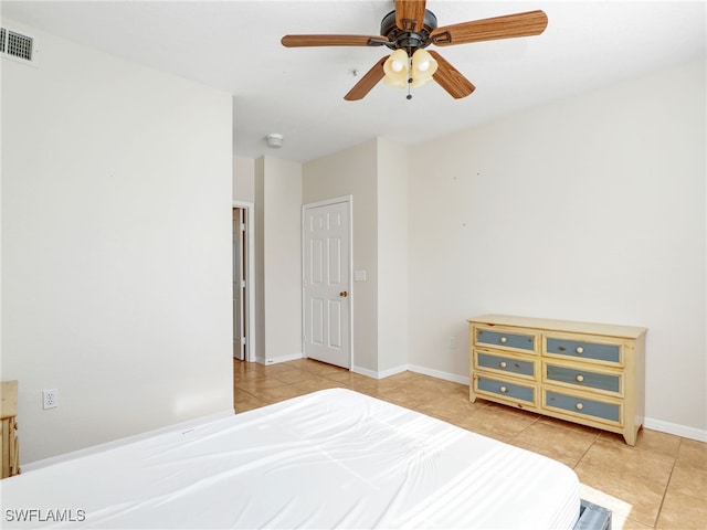 bedroom with tile patterned flooring and ceiling fan