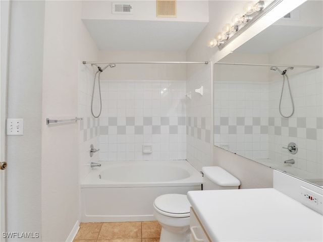 full bathroom with vanity, toilet, tile patterned floors, and tiled shower / bath