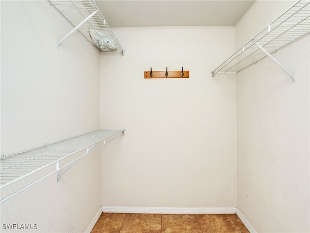 walk in closet featuring tile patterned floors