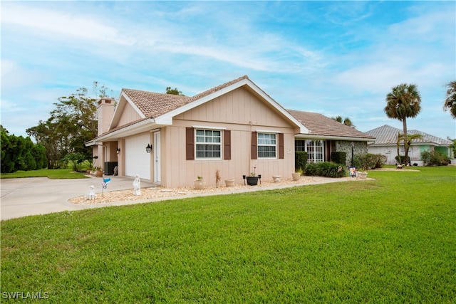 view of front of house featuring a front yard and a garage