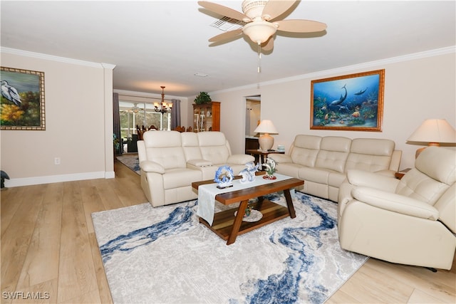 living room featuring crown molding, light hardwood / wood-style flooring, and ceiling fan with notable chandelier